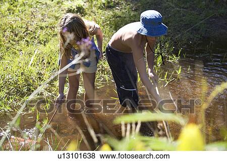A young boy and girl with fishing nets View Large Photo Image Stock Photo - A young boy and girl with fishing nets. Fotosearch
