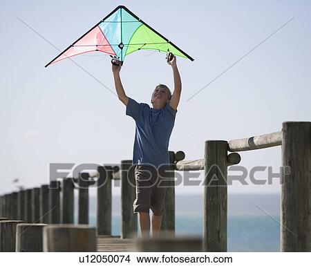 Picture - A young boy with a kite. Fotosearch