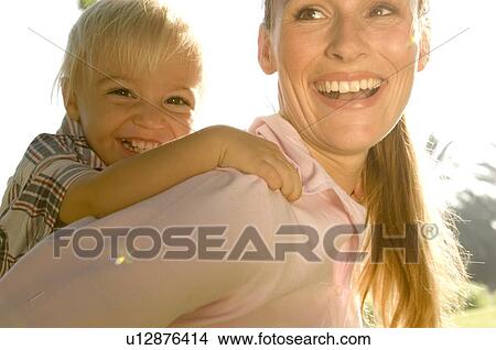 Picture - A young boy with his mother. Fotosearch