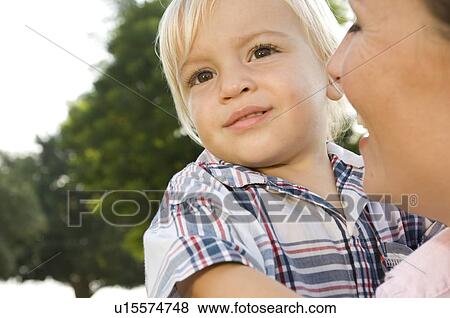Stock Photo - A young boy with his mother. Fotosearch