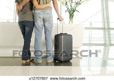 A young couple at a reception desk View Large Photo Image Stock Photo - A young couple at a reception desk. Fotosearch