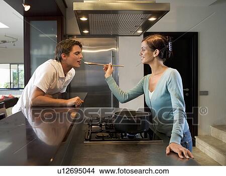 Picture - A young couple at home. Fotosearch