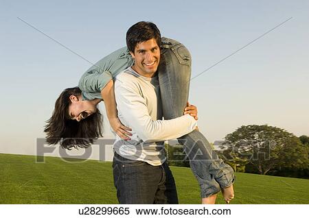 Stock Photography - A young couple in a park. Fotosearch