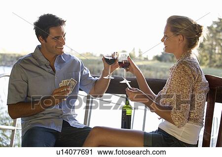 A young couple playing cards View Large Photo Image Stock Image - A young couple playing cards. Fotosearch