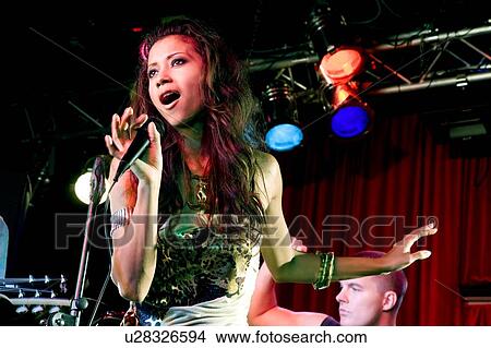 A young female singer performing View Large Photo Image Picture - A young female singer performing. Fotosearch