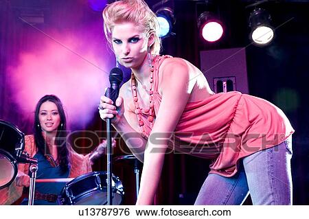 A young female singer performing View Large Photo Image Stock Photograph - A young female singer performing. Fotosearch