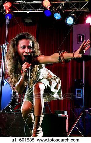 Stock Photography - A young female singer performing. Fotosearch