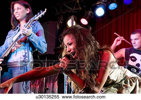 A young female singer performing View Large Photo Image Stock Photography - A young female singer performing. Fotosearch