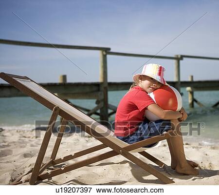 A young girl with a beach ball View Large Photo Image Stock Photo - A young girl with a beach ball. Fotosearch