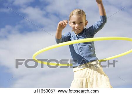 Stock Photo - A young girl with a hoop. Fotosearch