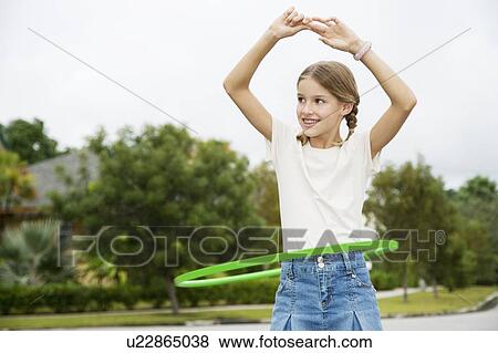 A young girl with a hoop View Large Photo Image Stock Photo - A young girl with a hoop. Fotosearch