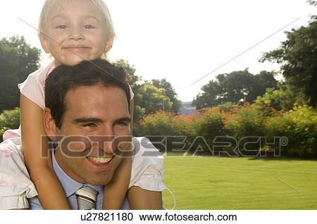 A young girl with her father View Large Photo Image Stock Image - A young girl with her father. Fotosearch