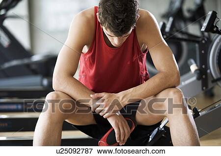 A young man at a gym View Large Photo Image Stock Photo - A young man at a gym. Fotosearch