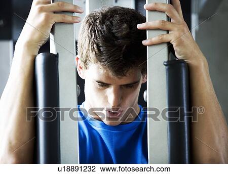 A young man exercising View Large Photo Image Stock Image - A young man exercising. Fotosearch