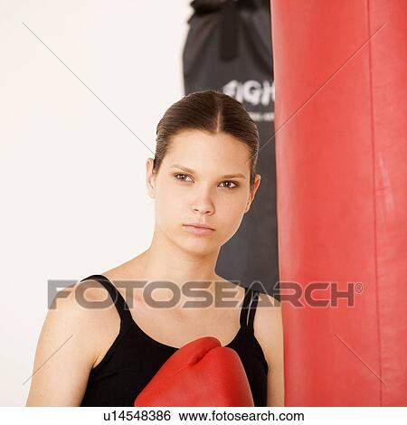 A young woman boxing View Large Photo Image Stock Photograph - A young woman boxing. Fotosearch