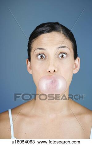 A young woman chewing bubble gum View Large Photo Image Stock Image - A young woman chewing bubble gum. Fotosearch