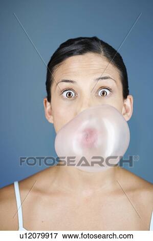 A young woman chewing bubble gum View Large Photo Image Stock Photo - A young woman chewing bubble gum. Fotosearch
