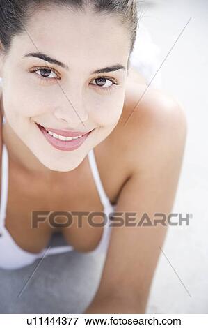 A young woman in bikini looking into camera View Large Photo Image Stock Photo - A young woman in bikini looking into camera. Fotosearch