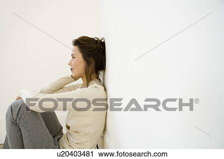 A young woman using a mobile phone View Large Photo Image Stock Image - A young woman using a mobile phone. Fotosearch