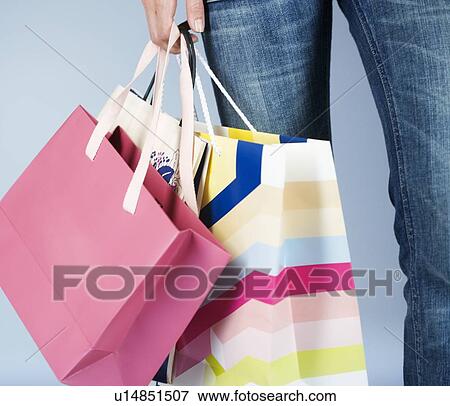A young woman with shopping bags View Large Photo Image Stock Photo - A young woman with shopping bags. Fotosearch