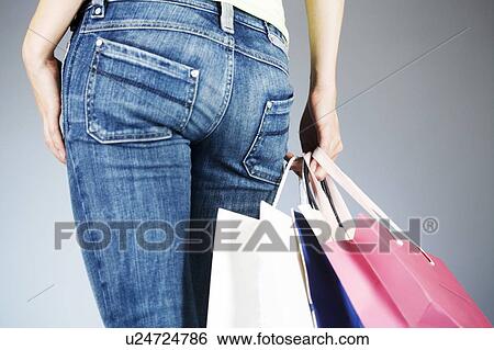 A young woman with shopping bags View Large Photo Image Stock Photograph - A young woman with shopping bags. Fotosearch