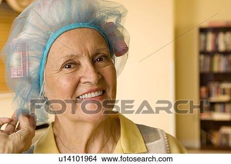 An elderly woman wearing curlers View Large Photo Image Picture - An elderly woman wearing curlers. Fotosearch