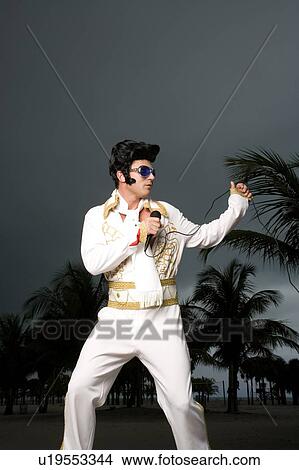An Elvis impersonator View Large Photo Image Picture - An Elvis impersonator. Fotosearch