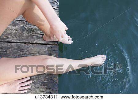 Stock Image - Barefeet in water. Fotosearch