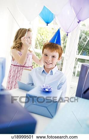 boy and girl at birthday party View Large Photo Image Stock Image - boy and girl at birthday party. Fotosearch