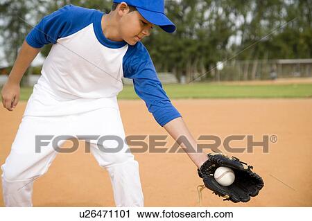 Boy catching baseball in glove View Large Photo Image Stock Image - Boy catching baseball in glove. Fotosearch
