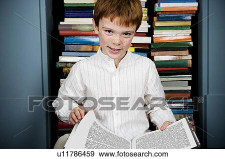 Stock Photo - boy reading book. Fotosearch