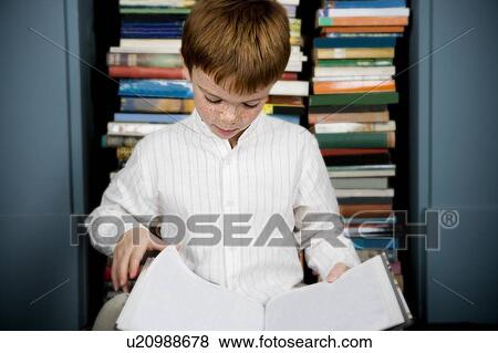 Stock Photo - boy reading book. Fotosearch