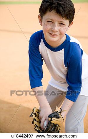 Stock Photo - Boy with catcher's mitt and baseball. Fotosearch