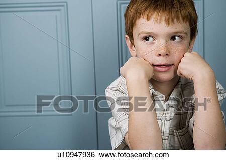 boy with ginger hair resting face in hands View Large Photo Image Stock Photograph - boy with ginger hair resting face in hands. Fotosearch