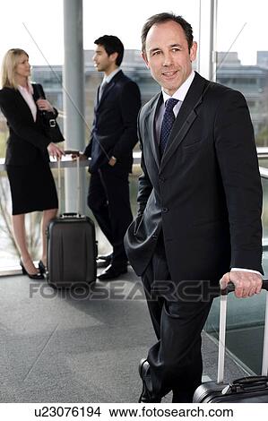 Business people traveling, waiting in airport or station View Large Photo Image Picture - Business people traveling, waiting in airport or station. Fotosearch