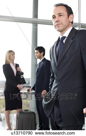 Business people traveling, waiting in airport or station View Large Photo Image Stock Image - Business people traveling, waiting in airport or station. Fotosearch