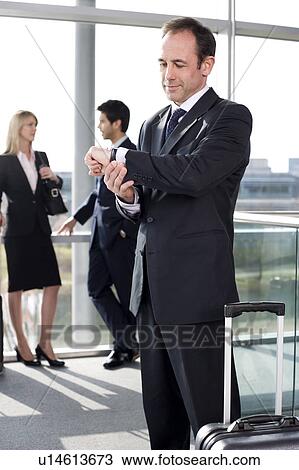 Business people traveling, waiting in airport or station View Large Photo Image Stock Image - Business people traveling, waiting in airport or station. Fotosearch
