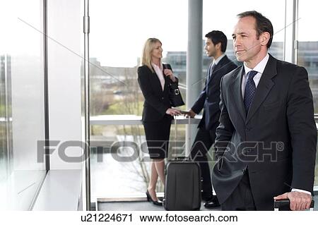 Business people traveling, waiting in airport or station View Large Photo Image Stock Image - Business people traveling, waiting in airport or station. Fotosearch