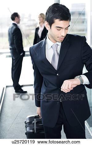 Business people traveling, waiting in airport or station View Large Photo Image Stock Photo - Business people traveling, waiting in airport or station. Fotosearch
