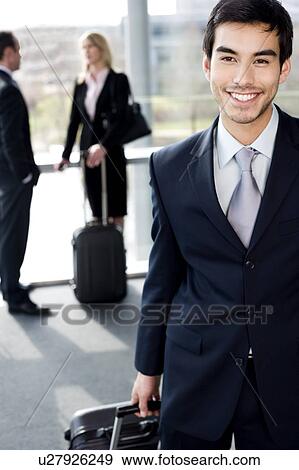 Business people traveling, waiting in airport or station View Large Photo Image Stock Photo - Business people traveling, waiting in airport or station. Fotosearch