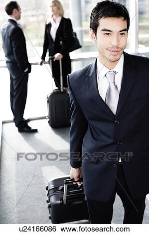 Business people traveling, waiting in airport or station View Large Photo Image Stock Photograph - Business people traveling, waiting in airport or station. Fotosearch