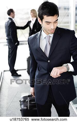 Business people traveling, waiting in airport or station View Large Photo Image Stock Photography - Business people traveling, waiting in airport or station. Fotosearch