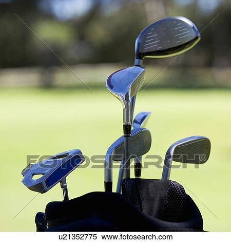 Stock Photography - Close-up of golf clubs in a bag. Fotosearch