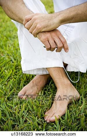 cropped image man's legs and bare feet on grass View Large Photo Image Stock Image - cropped image man's legs and bare feet on grass. Fotosearch
