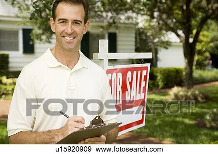Estate agent outside property for sale View Large Photo Image Stock Photo - Estate agent outside property for sale. Fotosearch