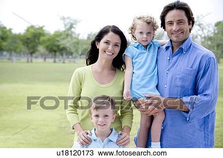 Stock Image - family portrait in park. Fotosearch