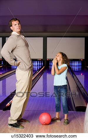 Father and daughter bowling in a bowling alley, father with backache View Large Photo Image Stock Image - Father and daughter bowling in a bowling alley, father with backache. Fotosearch