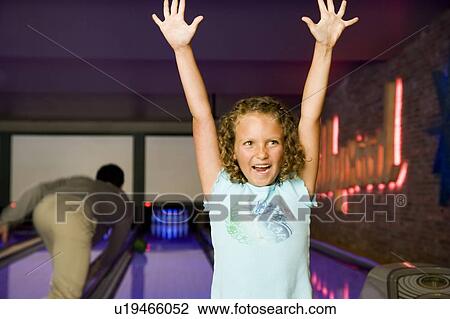 Father and daughter in a bowling alley, celebrating victory View Large Photo Image Stock Image - Father and daughter in a bowling alley, celebrating victory. Fotosearch