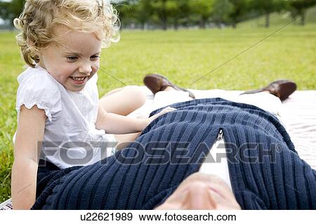 father and daughter on picnic rug View Large Photo Image Stock Photo - father and daughter on picnic rug. Fotosearch