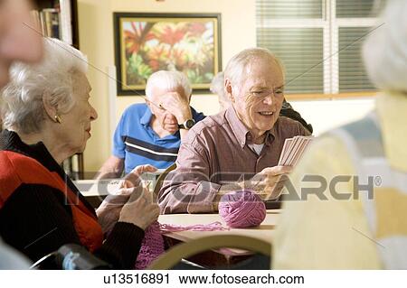 Stock Image - Five residents in a retirement home. Fotosearch